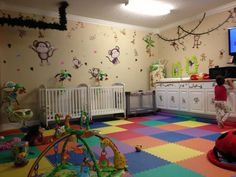 a child's playroom with toys, cribs and other items on the floor