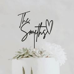 a wedding cake with the word'the sympathy'written on it and two forks in front of it