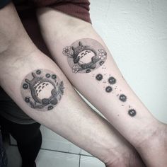 two people with matching tattoos on their arms