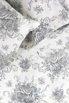 a white and black floral print sheet set