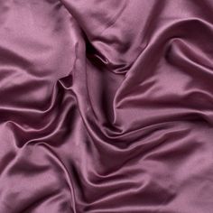 a close up view of a purple satin fabric