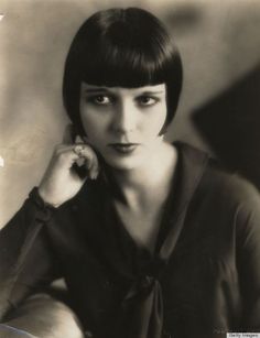 an old black and white photo of a woman