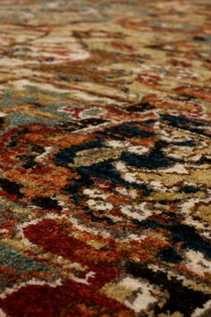 an area rug with many different colors and patterns