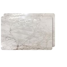 a white marble cutting board with silver veining on the top and bottom, in front of a white background