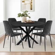 a black table with four chairs around it