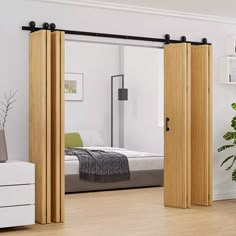 an open sliding door in a white bedroom