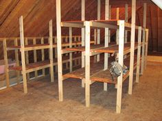 an attic with wooden shelves in it