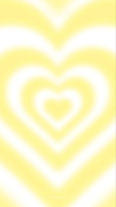 a yellow and white background with a large heart in the center, as if it were an optical illusion