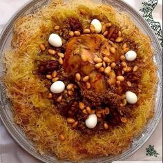 a plate with some food on it sitting on a white tablecloth covered table cloth