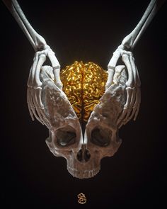 two human hands holding a golden ball in the shape of a skull with gold chains on it