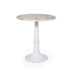 a small white table with a marble top and pedestal base, on a white background