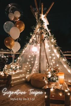 a teepee with balloons and lights on it is being used as a postcard