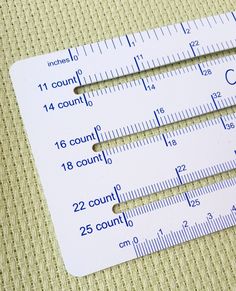 two rulers with numbers on them sitting next to each other, one measuring the area