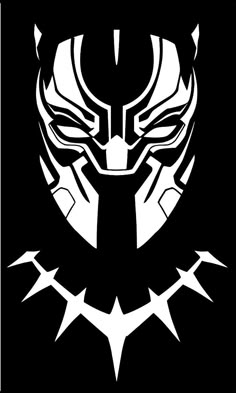 a black and white image of a stylized mask