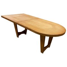 a wooden table with two legs and a long oval shaped top on an isolated white background