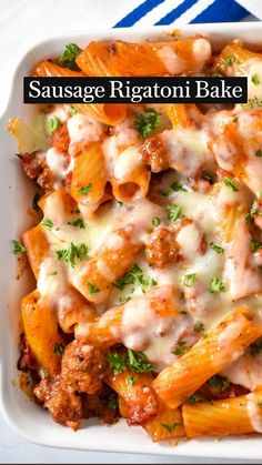 sausage rigatoni bake in a white casserole dish with parsley