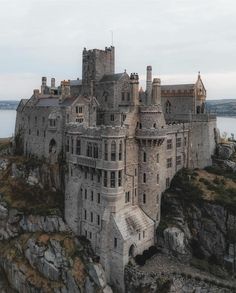 an old castle sitting on top of a cliff