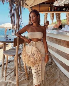 Inspired by a laid back, bohemian spirit that is perfect for resort wear, the HEIDI COVER UP set is made from a high quality crochet fabric. Featuring a simple, stretch bandeau style top and a maxi style skirt detailed with a leg split and tassel trim. Best worn for cocktails at the beach club with your besties. Fabric | Acrylic & Polyester Cheap Beachy Tank Top For Beach Party, Cheap Beach Dress For Vacation Beach Party, Cheap Spring Tops For Beach Party, Beachwear Tops For Vacation, Chic Cheap Beach Skirt, Luxury Beach Tops For Spring, Cheap Swimwear For Beach Party, Cheap Spring Sets With Ruffles, Luxury Summer Tube Top For Party