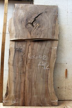 a large piece of wood with writing on it