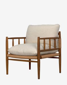 a wooden chair with a white cushion on it's back and armrests