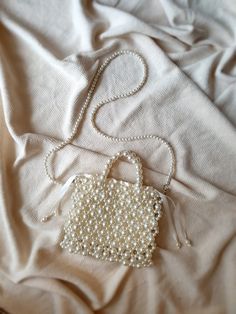 Pearl Beaded Bag, Pearl Wedding Bag Handbag Shoulder Bag, Pearl Purse, Pearl Evening Bag, Beaded Bag, Gift For Her, Bridal Bag, Removable Strap and with satin pouch Attention! Measurements in photos are in centimeters. In this shop, I produce stylish and timeless bags with my imagination. My bags are the combination of natural materials and handcraft. I design useful and different models with love. I can improve myself with your ideas and suggestions and produce bags according to your wishes. Le Square Wedding Bag With Pearl Handle, Pearl White Rectangular Wedding Bag, Pearl White Evening Bag With Pearl Embroidery, Beige Pearl Bags For Wedding, Beige Pearl Wedding Bags, Handmade Pearl Evening Bag For Wedding, Pearl White Shoulder Bag With Pearl Embroidery For Wedding, Pearl White Wedding Shoulder Bag With Pearl Embroidery, Pearl White Wedding Shoulder Bag With Pearl Handle