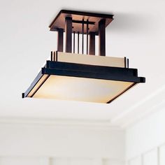 a light fixture hanging from the ceiling in a room