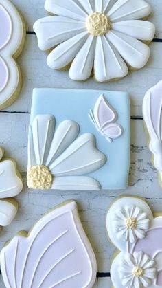 decorated cookies are arranged on a table