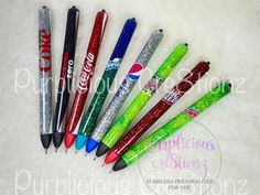 six pens are lined up in the shape of candy canes with glitter on them