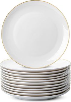 stack of white plates with gold rims