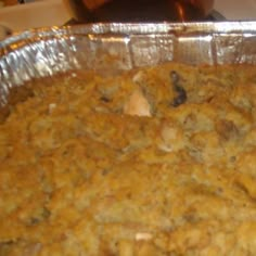 a casserole dish with meat and vegetables in it, ready to be eaten