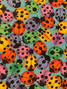 colorful ladybugs on blue background with black dots