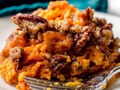 a close up of food on a plate with a fork