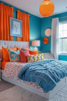 a bedroom with blue walls and orange curtains