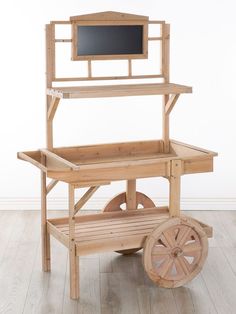 a wooden cart with wheels and a chalkboard on top