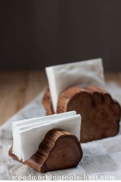 two pieces of wood sitting on top of a table