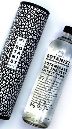 a bottle of botanical arganizer next to a tube of toothpaste on a white surface