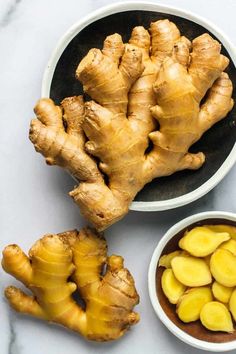 two bowls filled with sliced up ginger next to some cut up bananas and other ingredients