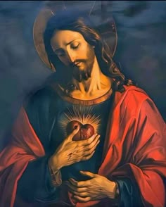 jesus holding an apple in his hands