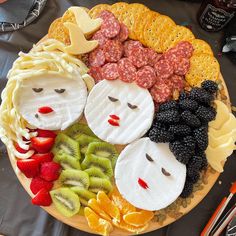 a plate filled with different types of fruit and veggies on top of each other