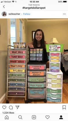 a woman standing in front of a stack of plastic containers filled with different types of labels