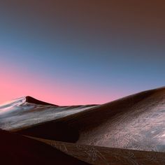 the sun is setting over some sand dunes