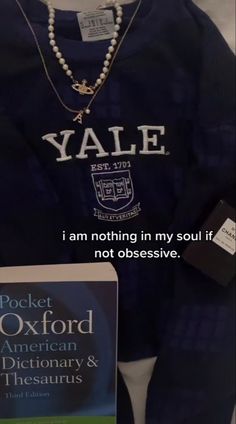 a book and some necklaces are on display