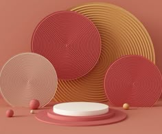 an image of three plates on the ground with balls around them and one plate in front of it