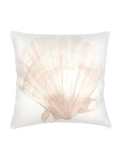 a white pillow with an image of a shell on it