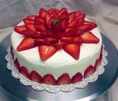 there is a cake with strawberries on it