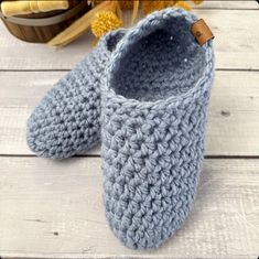 "Keep your toes toasty warm with these warm cozy knit handmade slippers. Crocheted from a thick soft yarn, they are sure to be the coziest slippers your feet have ever been in.  Slippers are gender neutral and are a perfect gift for yourself or someone in your life who needs some extra cozy comfort. They are great for wearing at home or for packing in your bag to bring along when visiting friends or family.  These cozy indoor slipper socks are super stretchy and won't cause constriction of your feet but will keep their shape as well.    ITEM DETAILS:   * Handmade with a soft bulky acrylic yarn which is a great option to wool slipper * Available in 20 colours  * Option of 4 different size  * Handcrafted in a hygienic enviorment at my cozy farm in small town Saskatchewan  * Fully washable fo Cozy Handmade Winter Slippers, Casual Crochet Slippers For Winter, Handmade Cozy Yarn Slippers, Casual Crochet Winter Slippers, Cozy Knitted Yarn Slippers, Casual Winter Yarn Slippers, Cozy Crochet Slippers For Winter, Cozy Yarn Slippers With Round Toe, Handmade Yarn Slippers For Winter