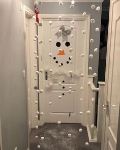 the door is decorated with snowmen and balls to decorate it for christmas or winter