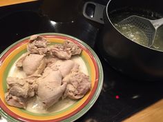 a plate with some food on it next to a pot