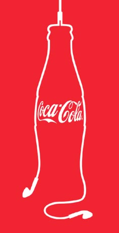 a coca - cola bottle with headphones on it and the word coke written in white