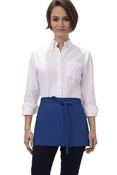 a woman wearing a white shirt and blue skirt with a tie around the waist, standing in front of a white background